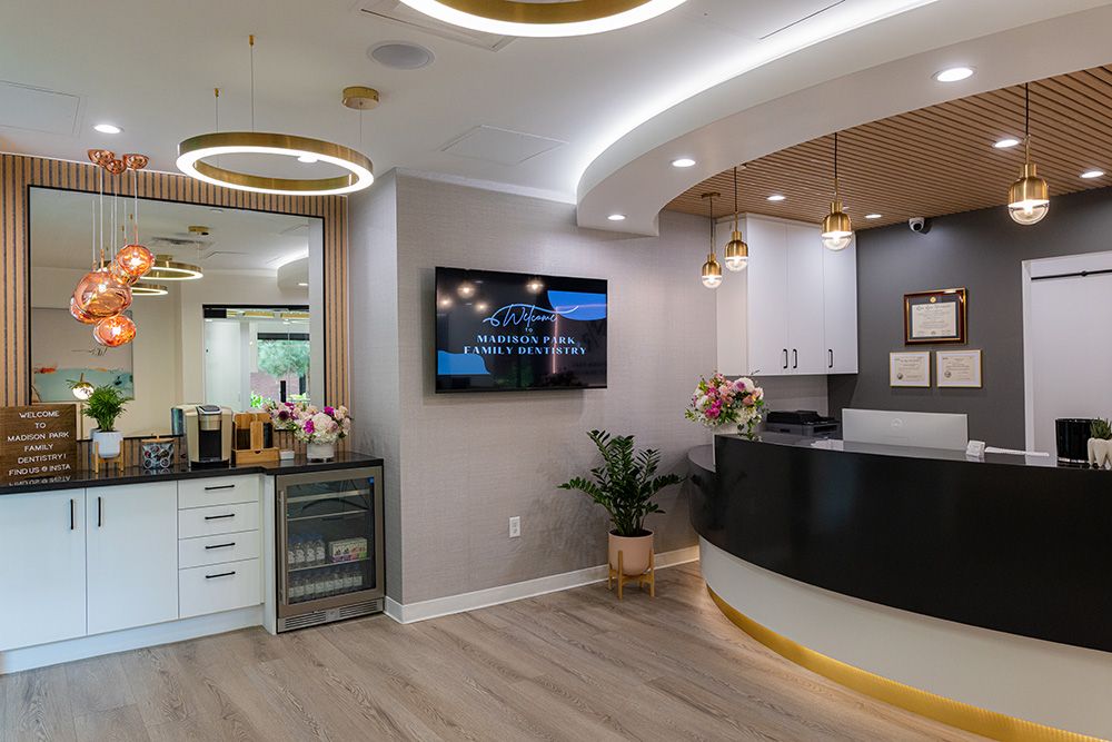 Welcoming lobby of Madison Park Family Dentistry with refreshment station and modern decor
